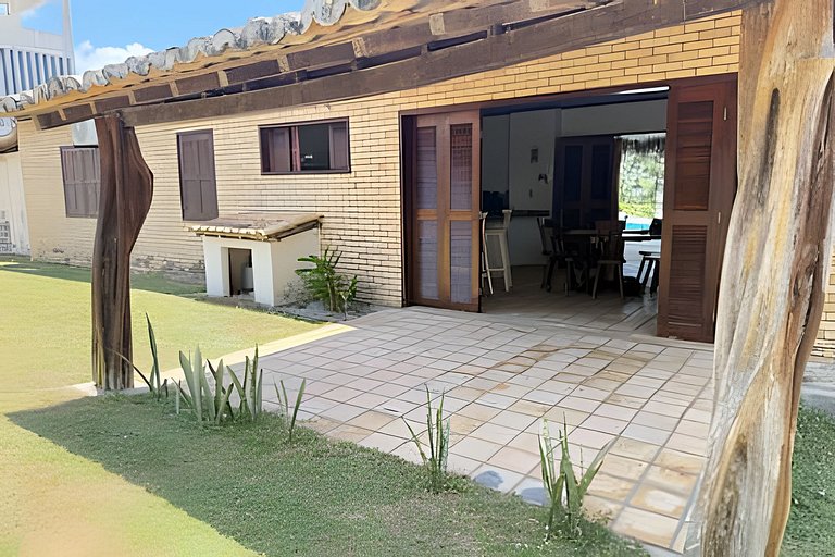 House with a pool and barbecue area in Tibau do Sul.