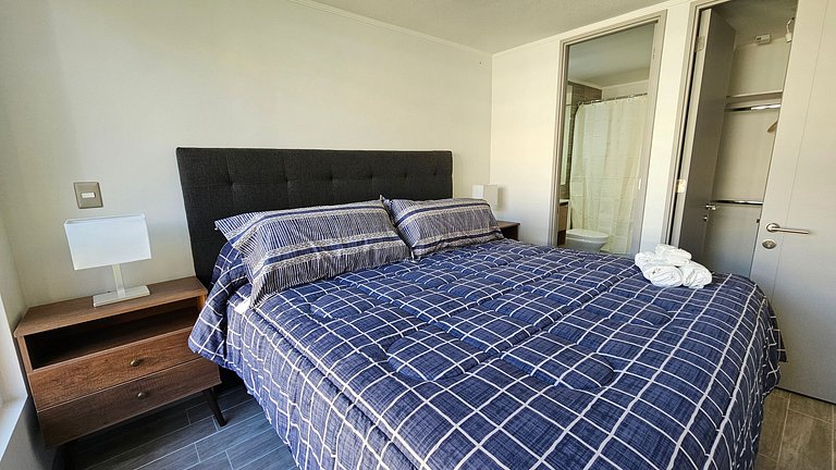 Departamento con A/C a pasos de Movistar Arena.